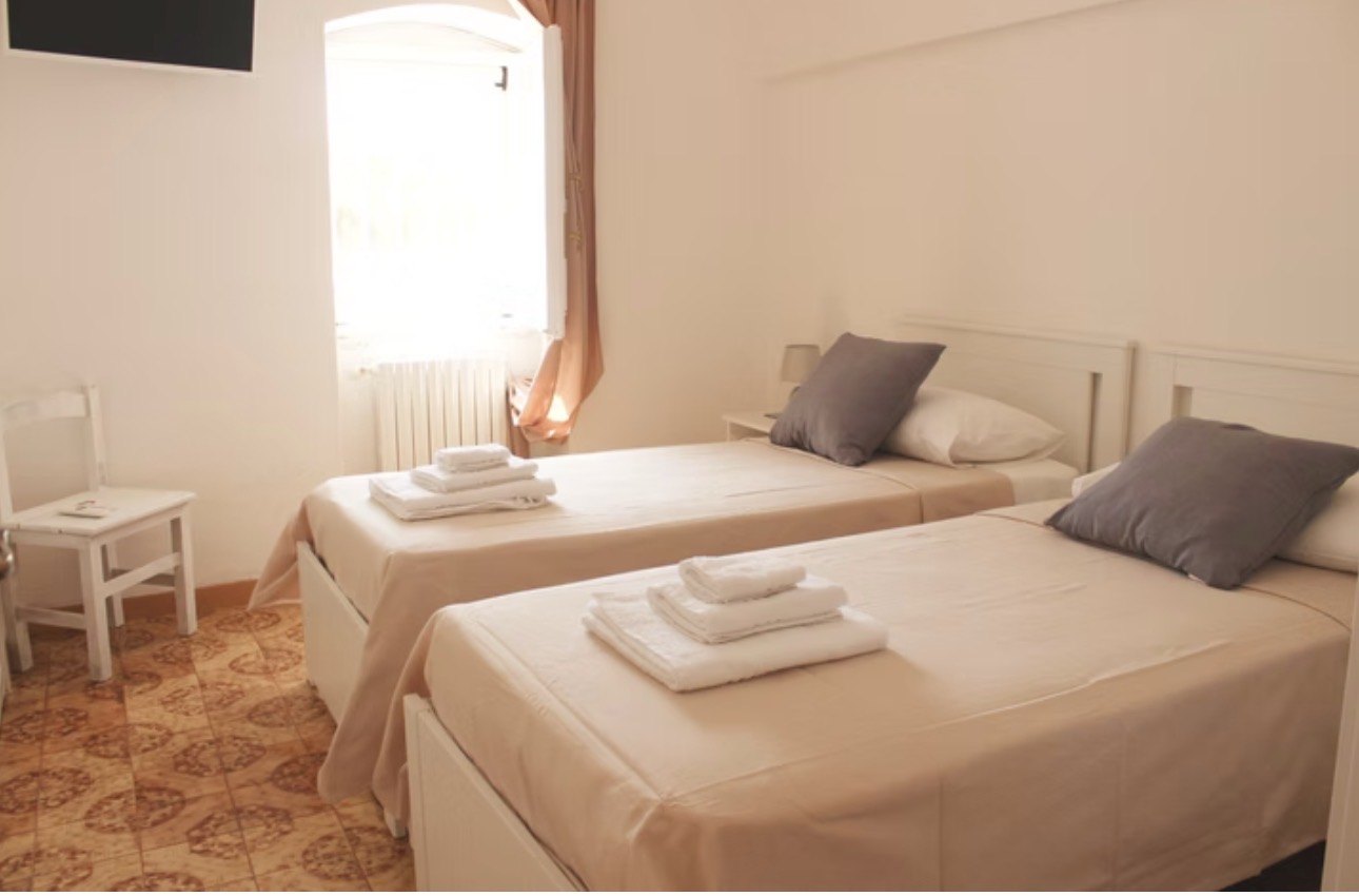 Shared room with two single beds at the writing retreat villa