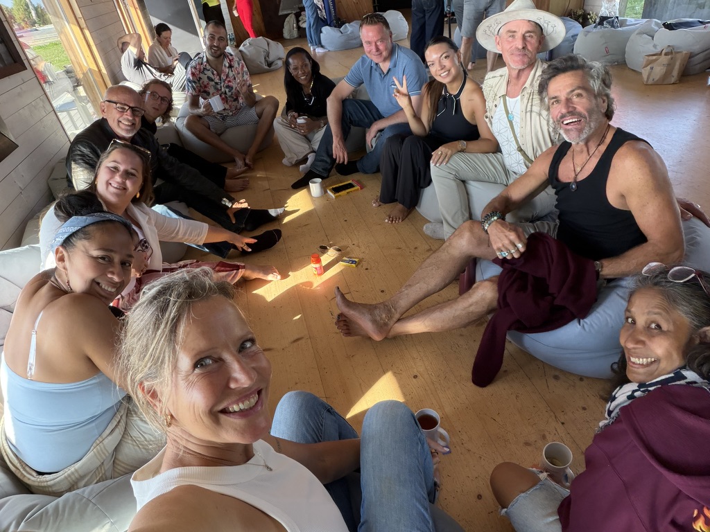 The Surrender Experiment – connection A group sharing a relaxed moment together on the island