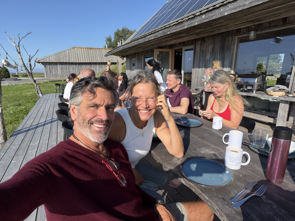 The Surrender Experiment – terrace Sharing a meal on the sunny island terrace